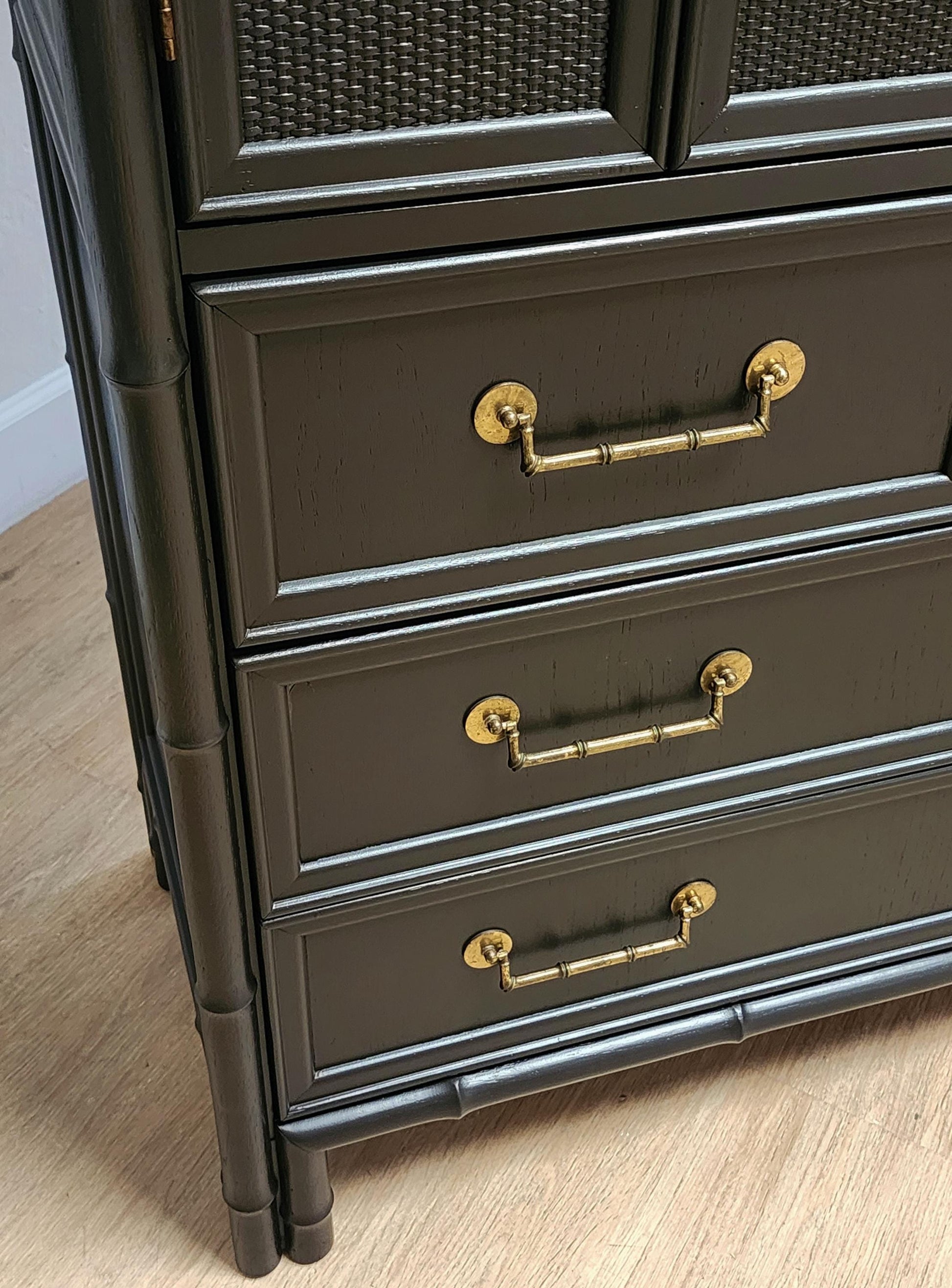 gold bamboo handles on black media console
